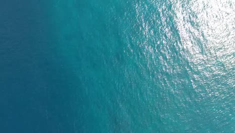 aerial top down view from high altitude of blue azure turquoise sea water texture