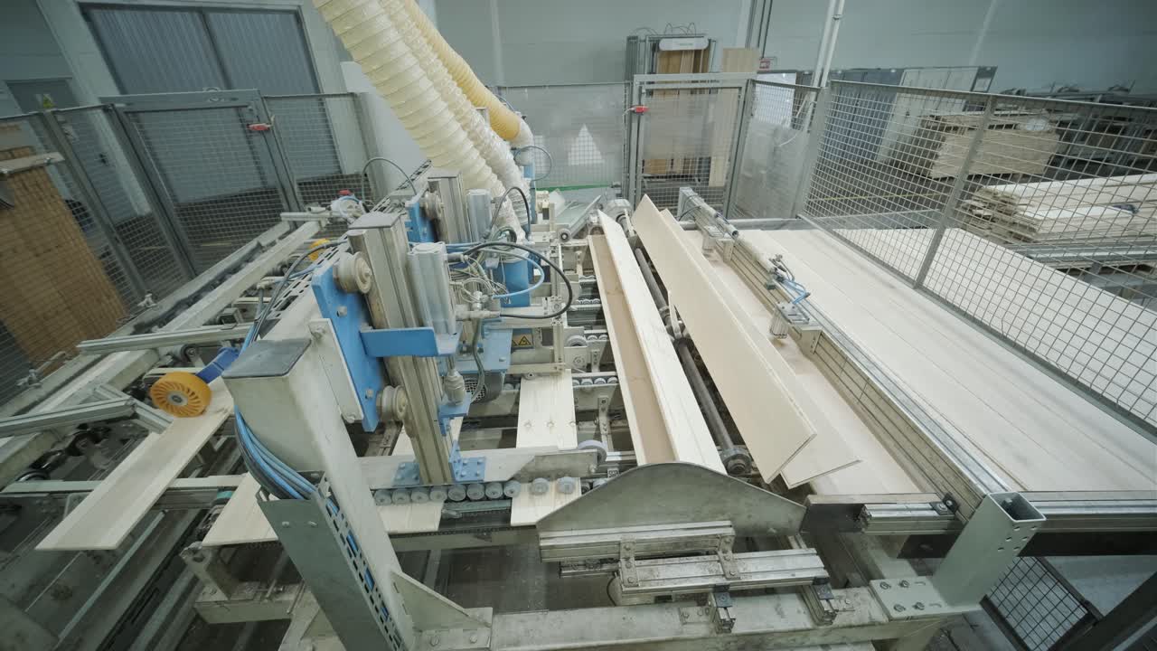Automated Woodworking Machine Processing Planks in Industrial Factory