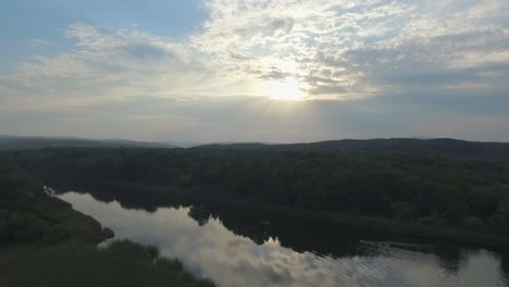 Flying-over-a-river-at-sunrise