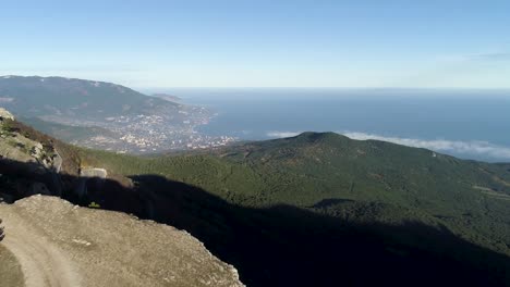 mountainous coastline with city view