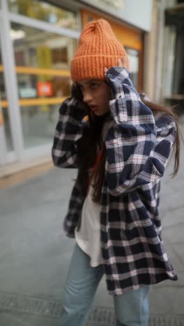 stylish woman in a plaid shirt and beanie