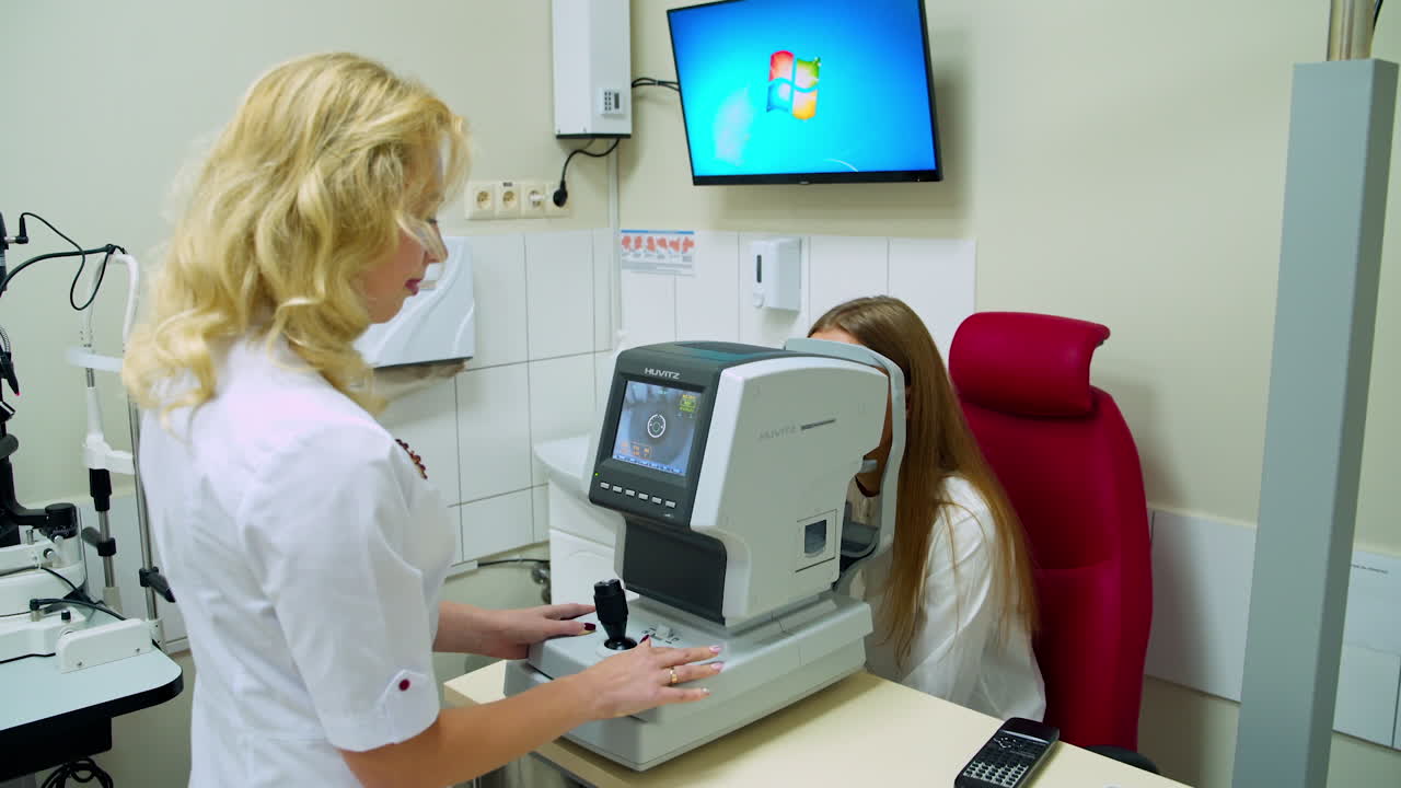 Optometrist checking patient eyesight. Ophthalmologist doing visual examination for customer at optical center
