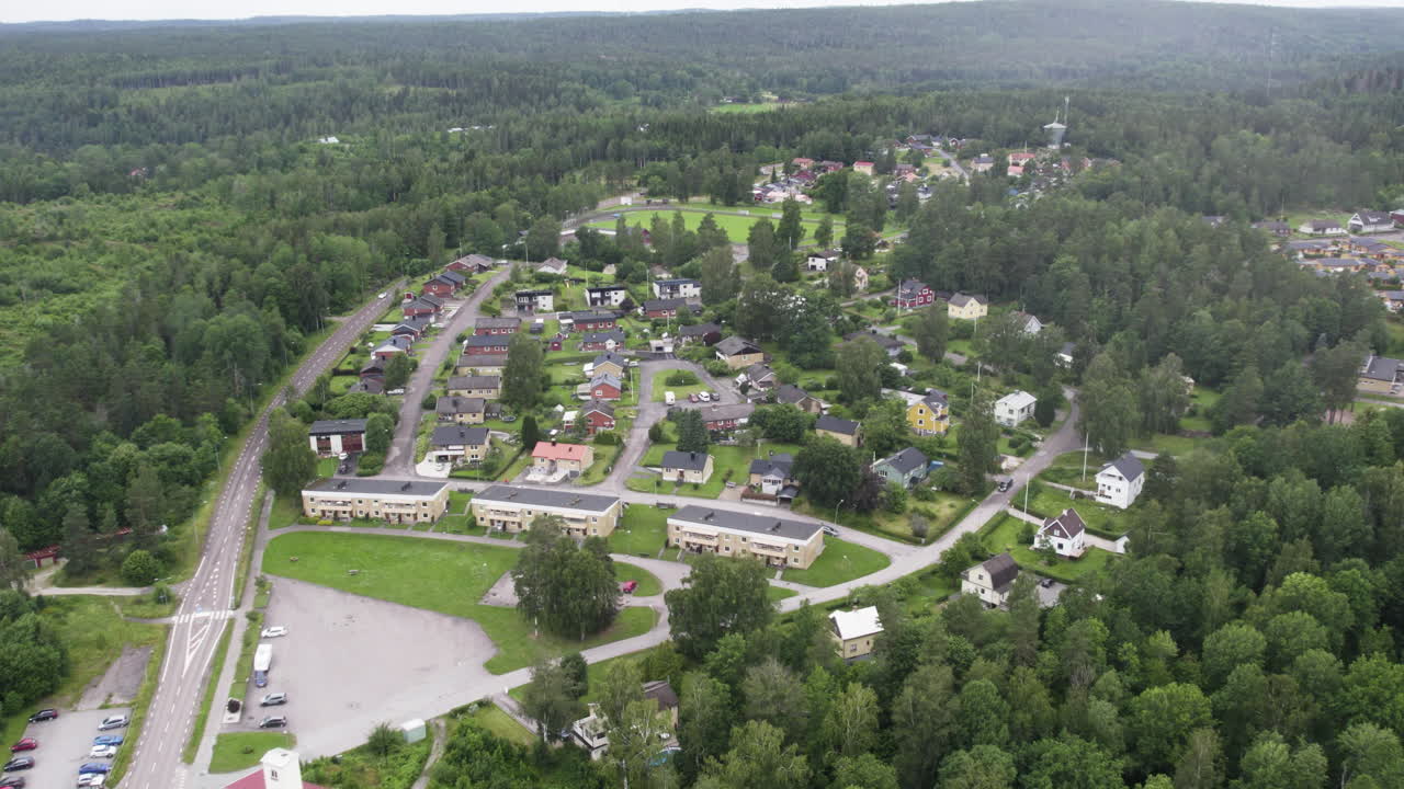 Åsensbruk, sweden, showcasing green landscapes and residential homes, aerial view