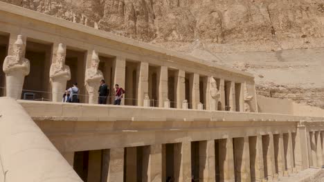 Hatshepsut-temple's-intricate-design-and-surrounding-landscapes,-Luxor-Egypt---pan