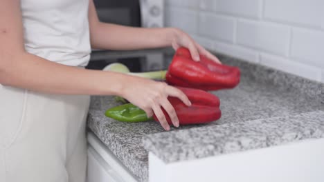 woman preparing vegetables in a kitchen