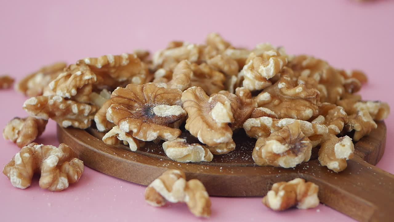 Close Up of Walnuts on Wooden Board