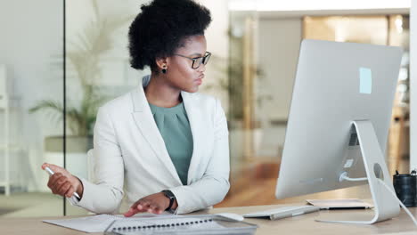 african female financial manager writing notes