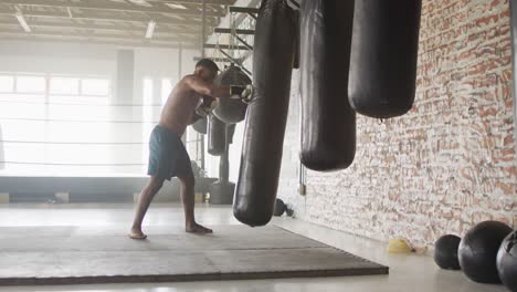 Video-of-fit-african-american-man-boxing-at-gym