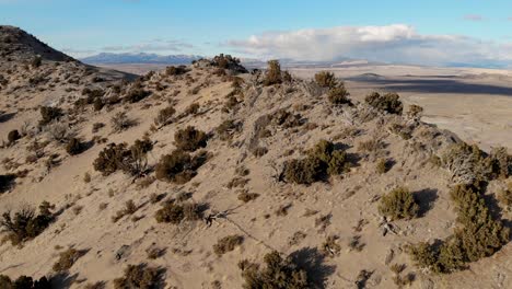 a spectacular 4k drone shot over the little sahara recreation area, a large area of sand dunes, hills and sagebrush flats located in the northeast corner of the sevier desert in nephi, utah