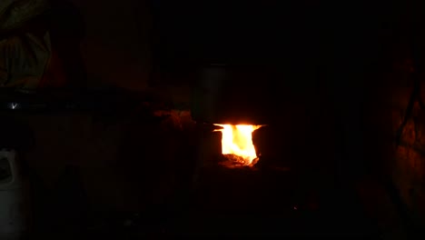 firewood burning for cooking in the traditional kitchen of nepal