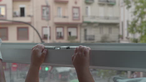 curious child is eager to look outside