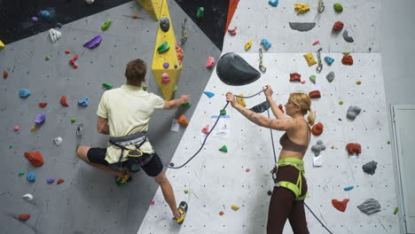 people in a climbing wall centre