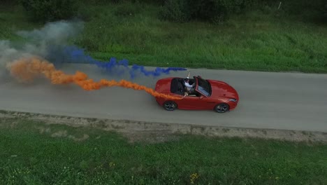 red convertible with smoke celebration