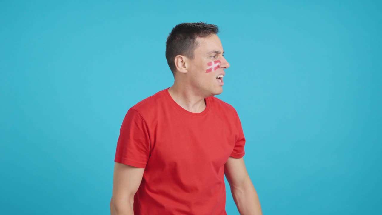 Man Cheering for Denmark, angry with the decision of referee