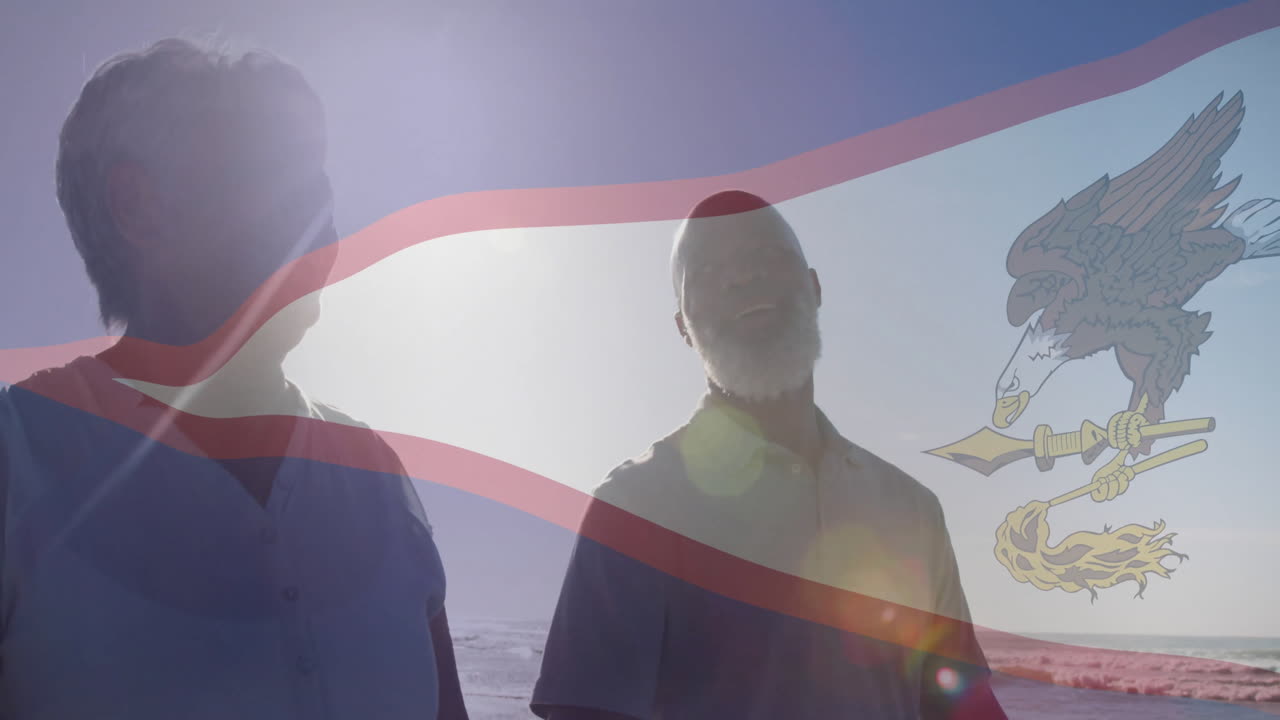 Walking on beach, two people with flag and animation overlay