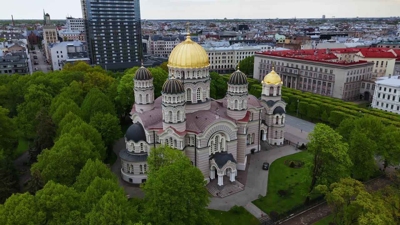 Nativity cathedral, riga with lush esplanade park in spring, aerial view