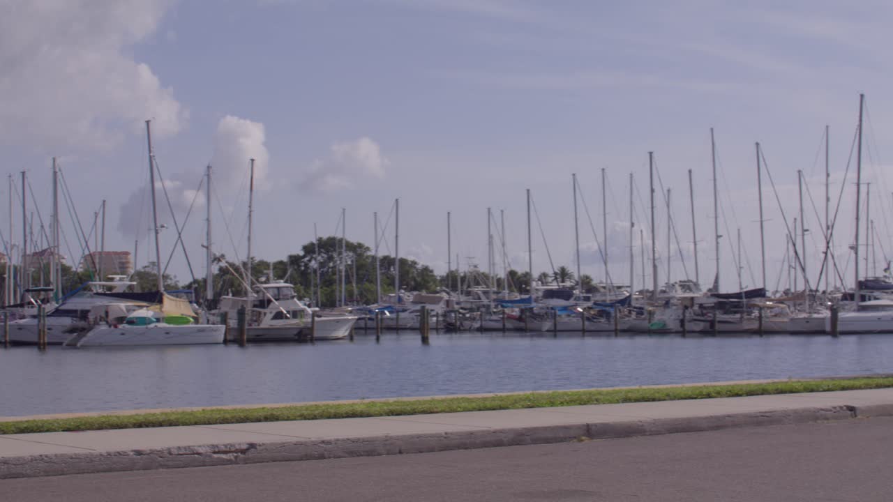 Boats and yachts in St. Petersburg, Florida marina with video panning right to left