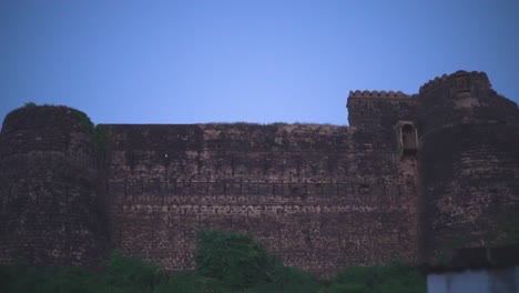 pan shot of an old ancient fort or castle in north india during twilight time