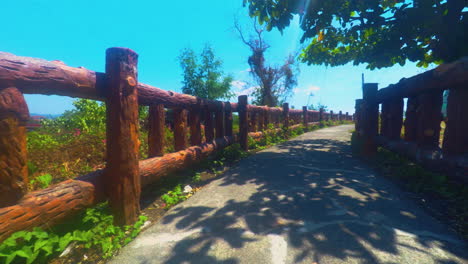 relaxing view of a pathway with fence and blue sky in the background, olongapo city, philippines