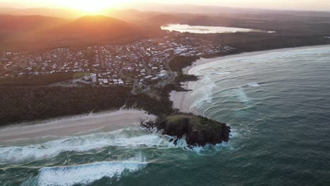 aerial view of coastal town at sunset