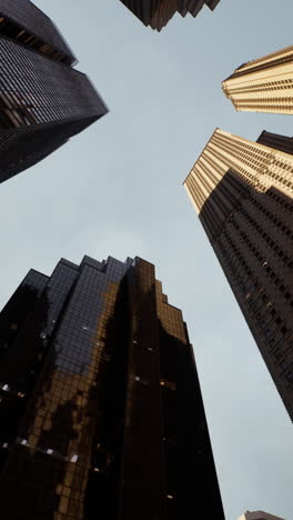 looking up at skyscrapers in a modern city