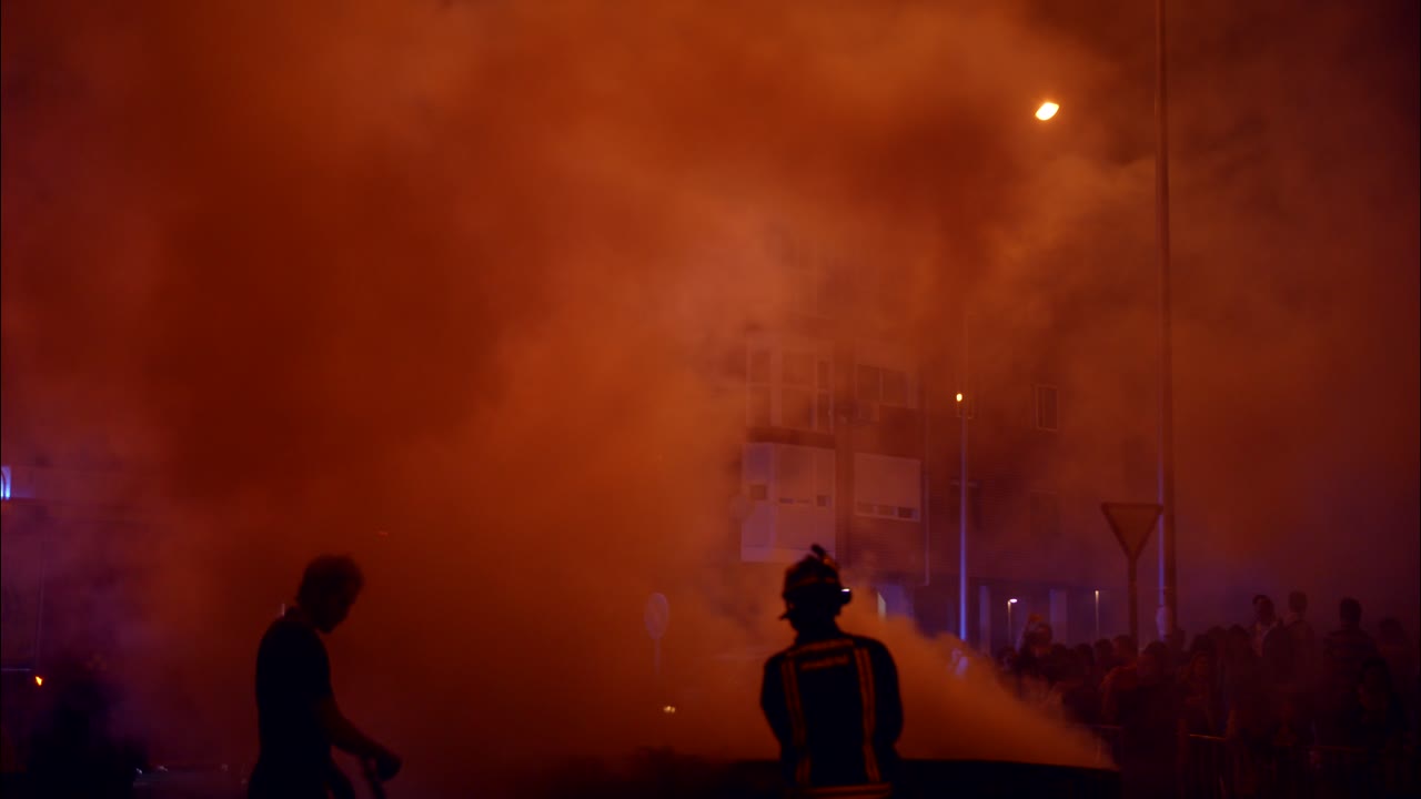 Dramatic Night Scene with Thick Smoke and Colorful Streetlights