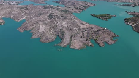 establishing aerial view over green lake scenic turquoise water in the taurus mountains of turkey