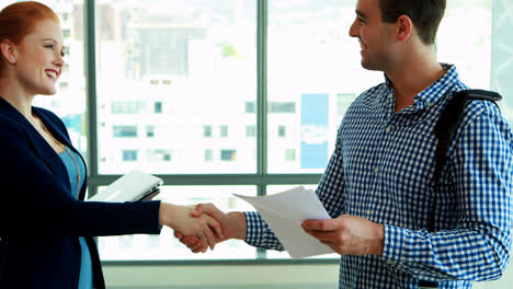 executives interacting with each other at desk