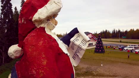 4k drone video of santa claus statue in north pole, alaksa during summer day