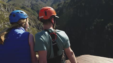 young caucasian couple in helmets