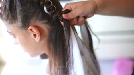 braiding a girl's hair