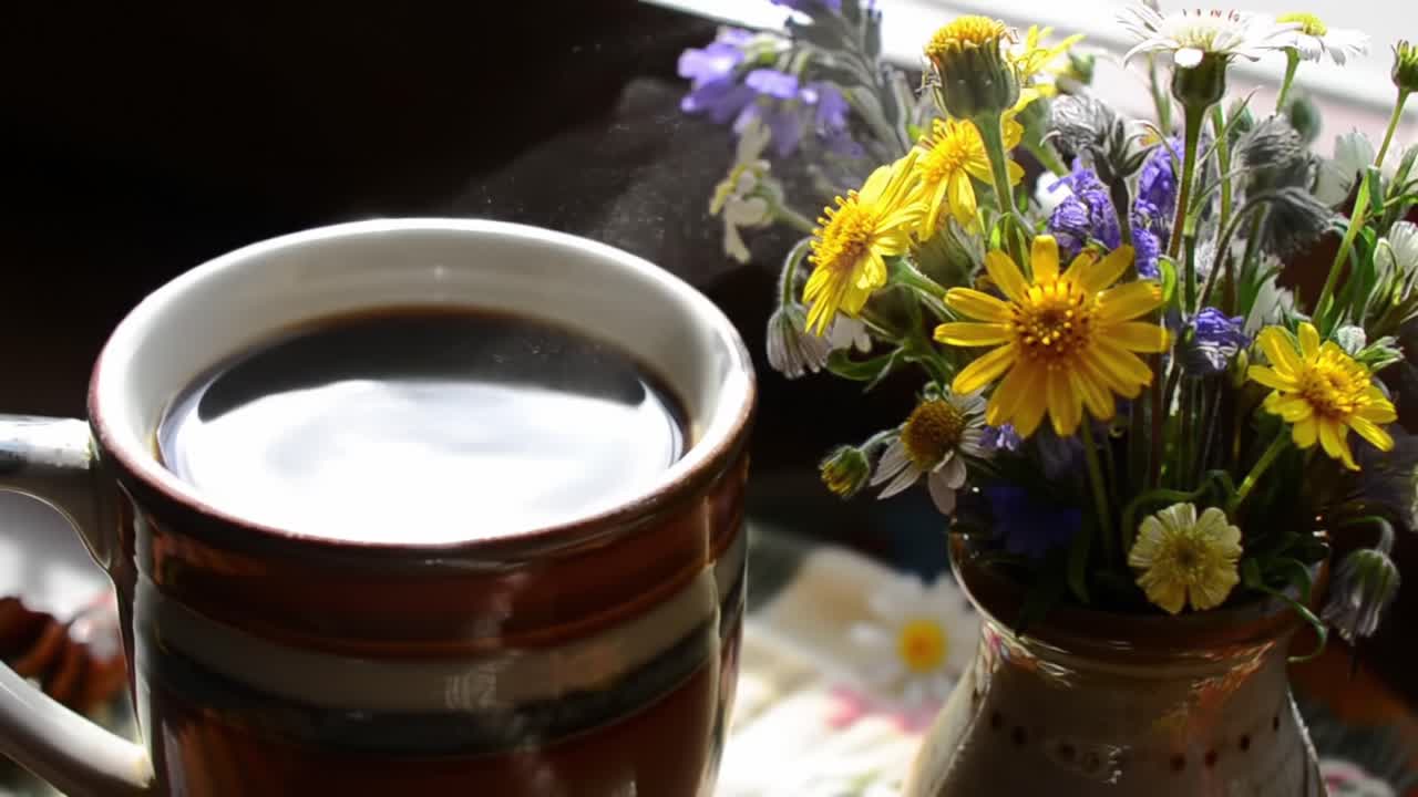 A Serene Moment of Morning Bliss: Hot Coffee Poured into a Warm Mug Beside a Charming Bouquet of Colorful Wildflowers in Soft Natural Light