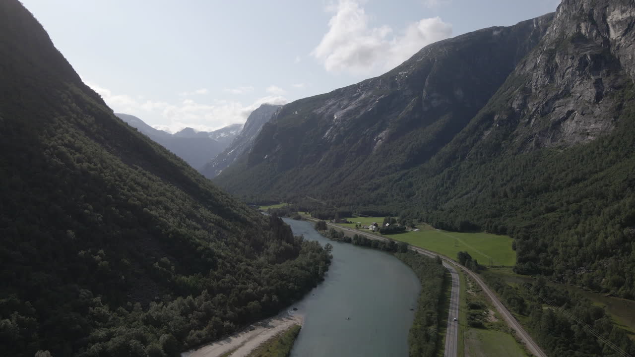 Rauma River Near Valley Road And Cars In Norwegian Mountains, Romsdalen Andalsnes, Norway - aerial shot