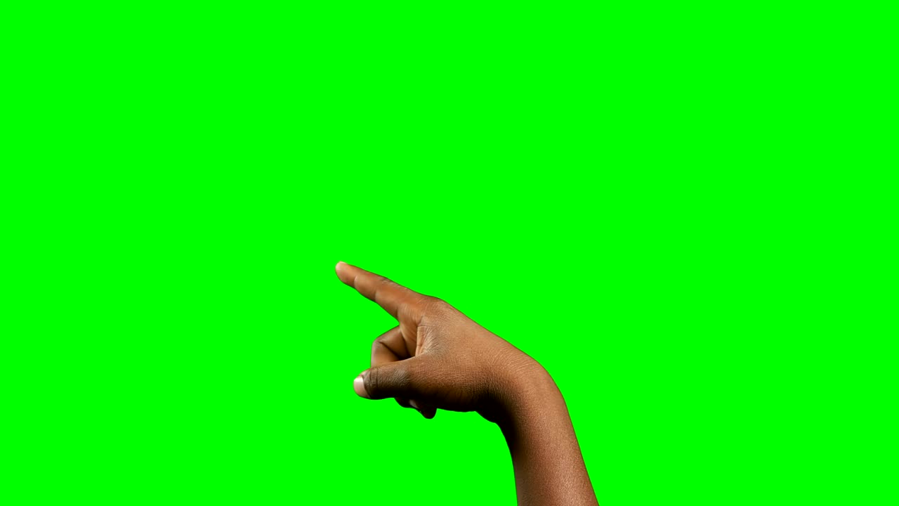 Person making hand gesture against green screen background