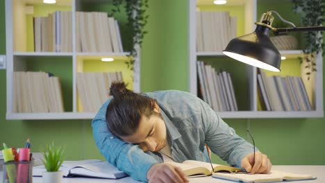 tired male student falling asleep.