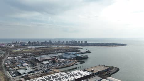 A-high-angle-view-above-Shore-Parkway-and-a-new-high-rise-construction-site-in-Brooklyn,-NY