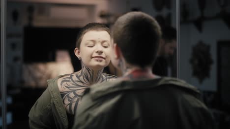 Young-adult-caucasian-woman-looking-at-herself-in-the-mirror.