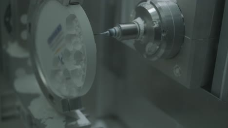 cnc machine cutting zirconia crowns from unfired zirconia