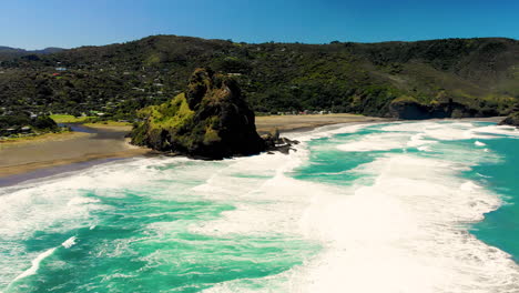 Famous-black-sand-beach,-popular-tourist-spot-near-Auckland
