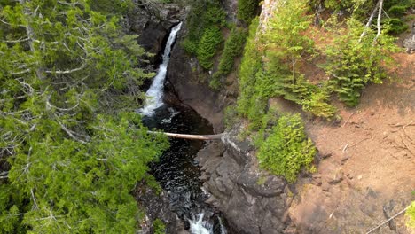 waterfall-in-the-middle-of-a-forest-in-North-Shore-area-Minnesota,-Caribou-Falls