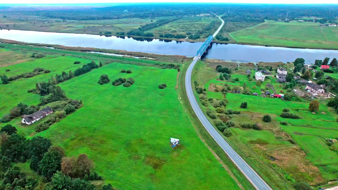 Stunning aerial view of the rural landscape in Latvia over a river