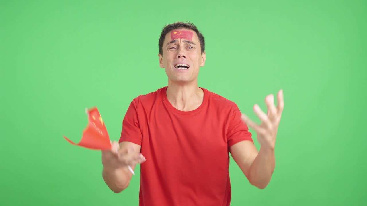 Man cheering for China during a match that is lost