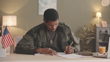 military man working from home