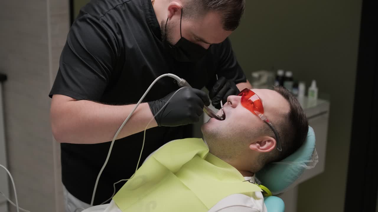 Dentist Performing Dental Procedure on Patient