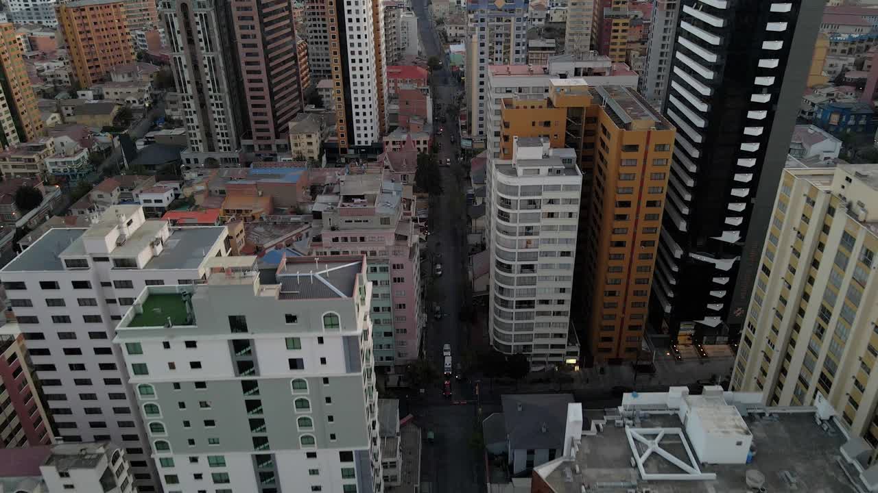 Afternoon aerial of La Paz, Bolivia’s colorful buildings rising above narrow street corridors