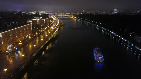 aerial view of night moscow with river and bridge russia