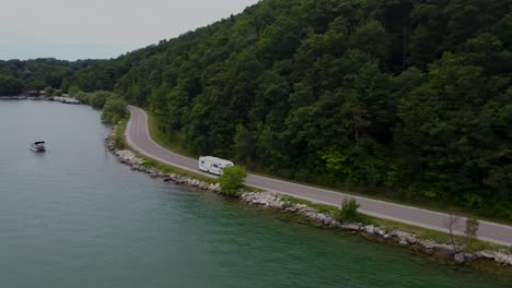 drone track of a coachmen driving on peninsula drive in traverse city, michigan