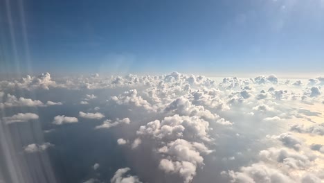 Aerial-view-of-sunrise-through-airplane-window-in-the-morning