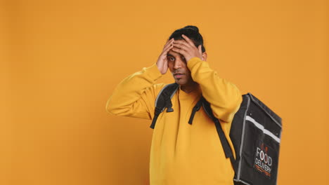 worker encumbered by too many food orders, dropping them, studio background