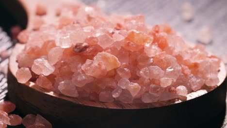 himalayan pink salt in a wooden is used to flavor food. due mainly to marketing costs, pink himalayan salt is up to twenty times more expensive than table or sea salt.